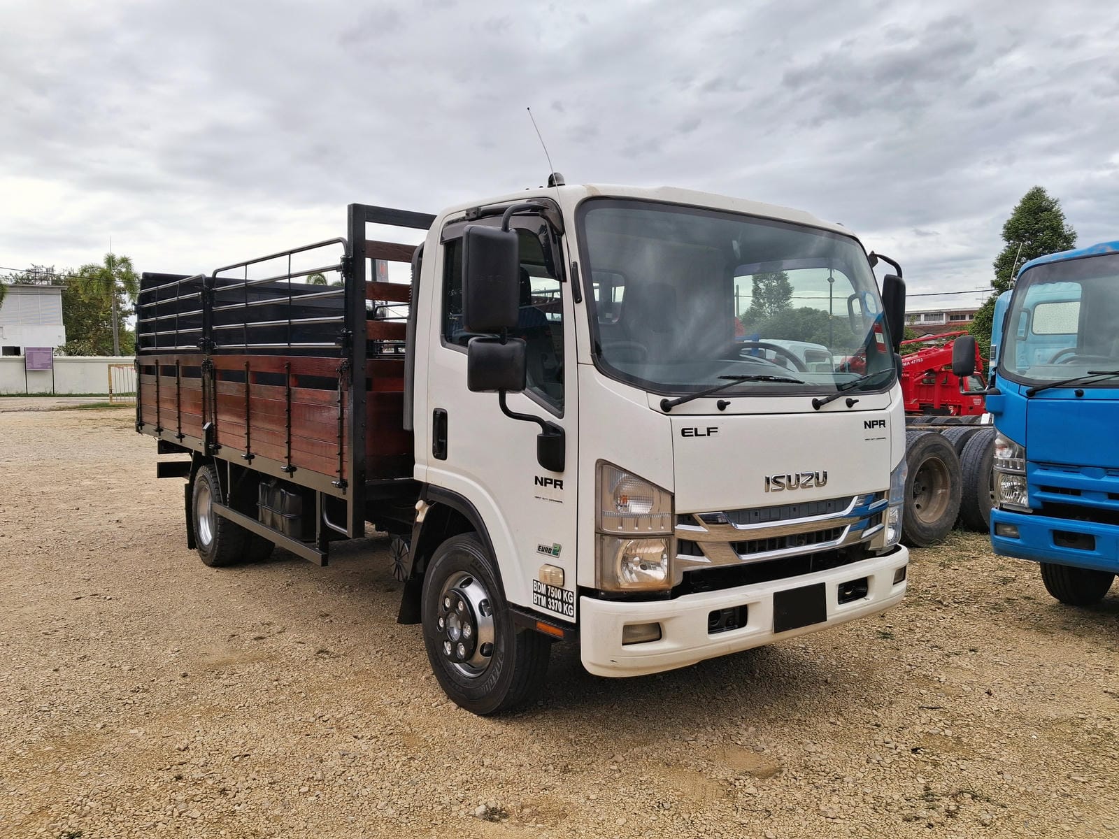 Used Isuzu NPR75 Wooden Cargo with Tail Lift - Image 1